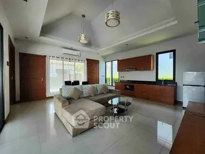 Spacious modern living room with open kitchen and elegant decor