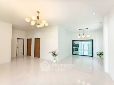 Spacious modern living area with elegant lighting and sleek marble flooring