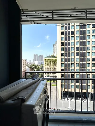 Modern balcony view with cityscape and washing machine setup
