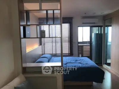 Modern bedroom with stylish partition and natural light
