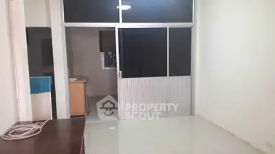 Spacious room with sliding glass doors and minimalistic design