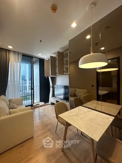Modern living room with elegant decor and city view from balcony