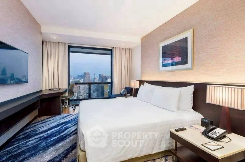 Luxurious bedroom with city view, modern decor, and large window.