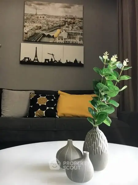 Stylish living room with modern decor and cityscape artwork