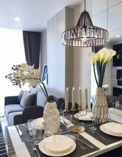 Modern dining area with elegant decor and stylish lighting in a cozy apartment.