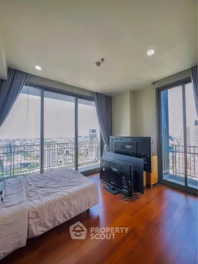 Spacious bedroom with stunning city view and large windows