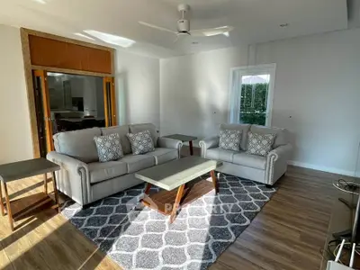 Spacious living room with stylish sofas and natural light