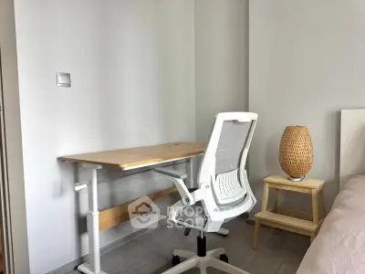 Modern study room with ergonomic chair and stylish desk in a minimalist design.
