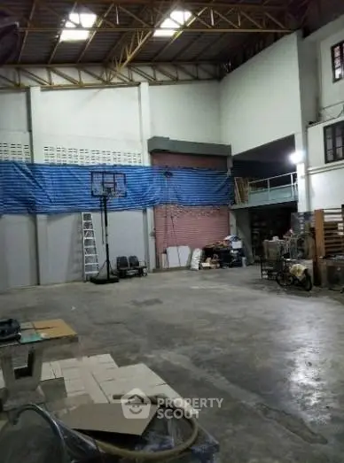 Spacious industrial warehouse with high ceilings and ample storage space.