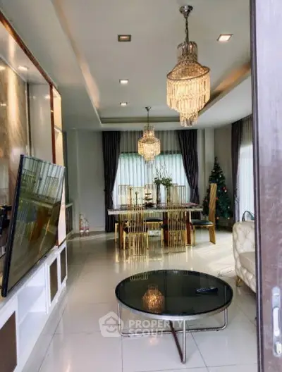 Luxurious living room with elegant chandeliers and modern decor, perfect for sophisticated living.