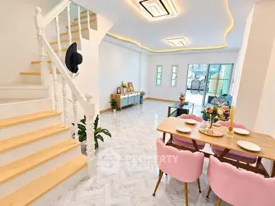Spacious modern living room with elegant dining area and stylish staircase