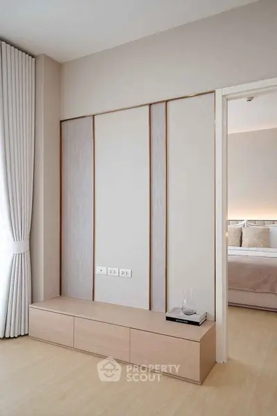 Modern minimalist bedroom with elegant wooden paneling and soft lighting