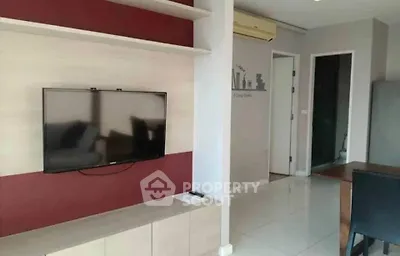 Modern living room with wall-mounted TV and stylish decor