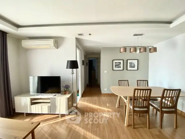 Spacious living room with modern furniture and elegant dining area