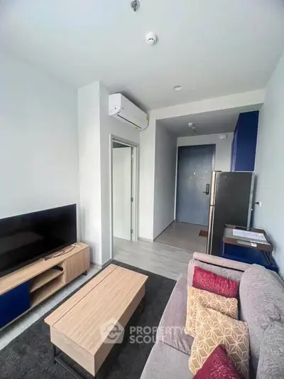 Modern living room with sleek furniture and air conditioning in a stylish apartment.