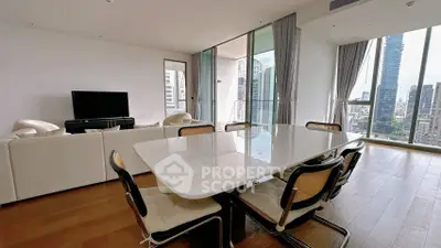 Luxurious modern living room with city view and elegant dining area