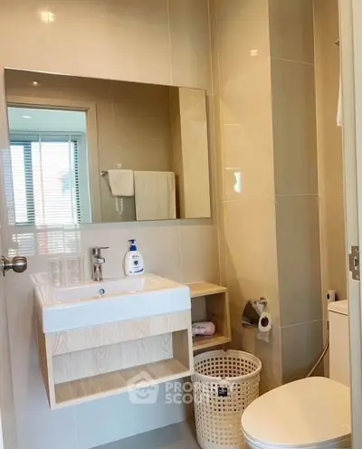 Modern bathroom with sleek fixtures and ample natural light