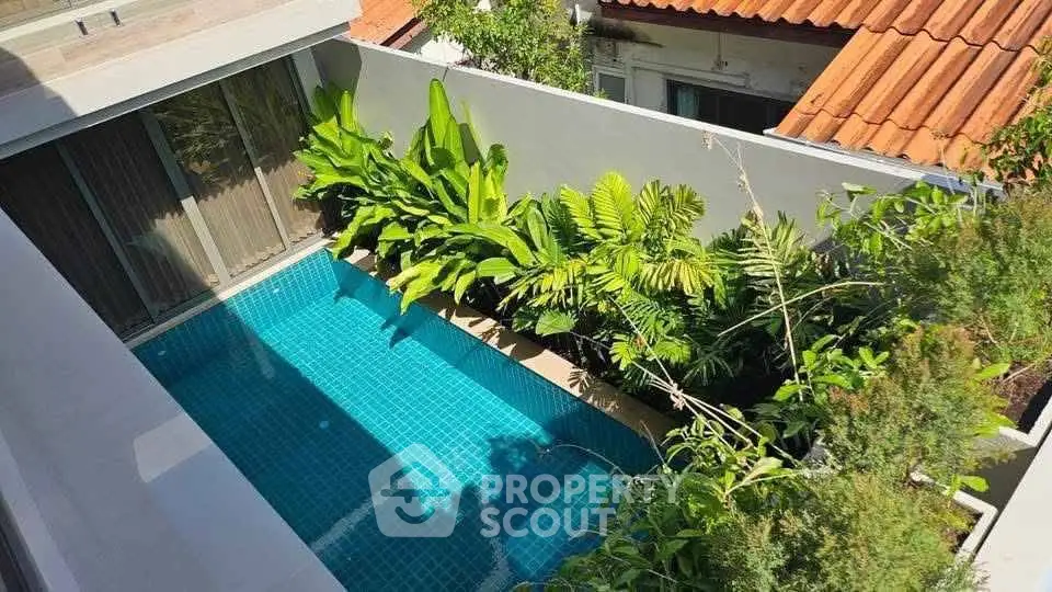 Luxurious private pool with lush greenery in modern residential setting