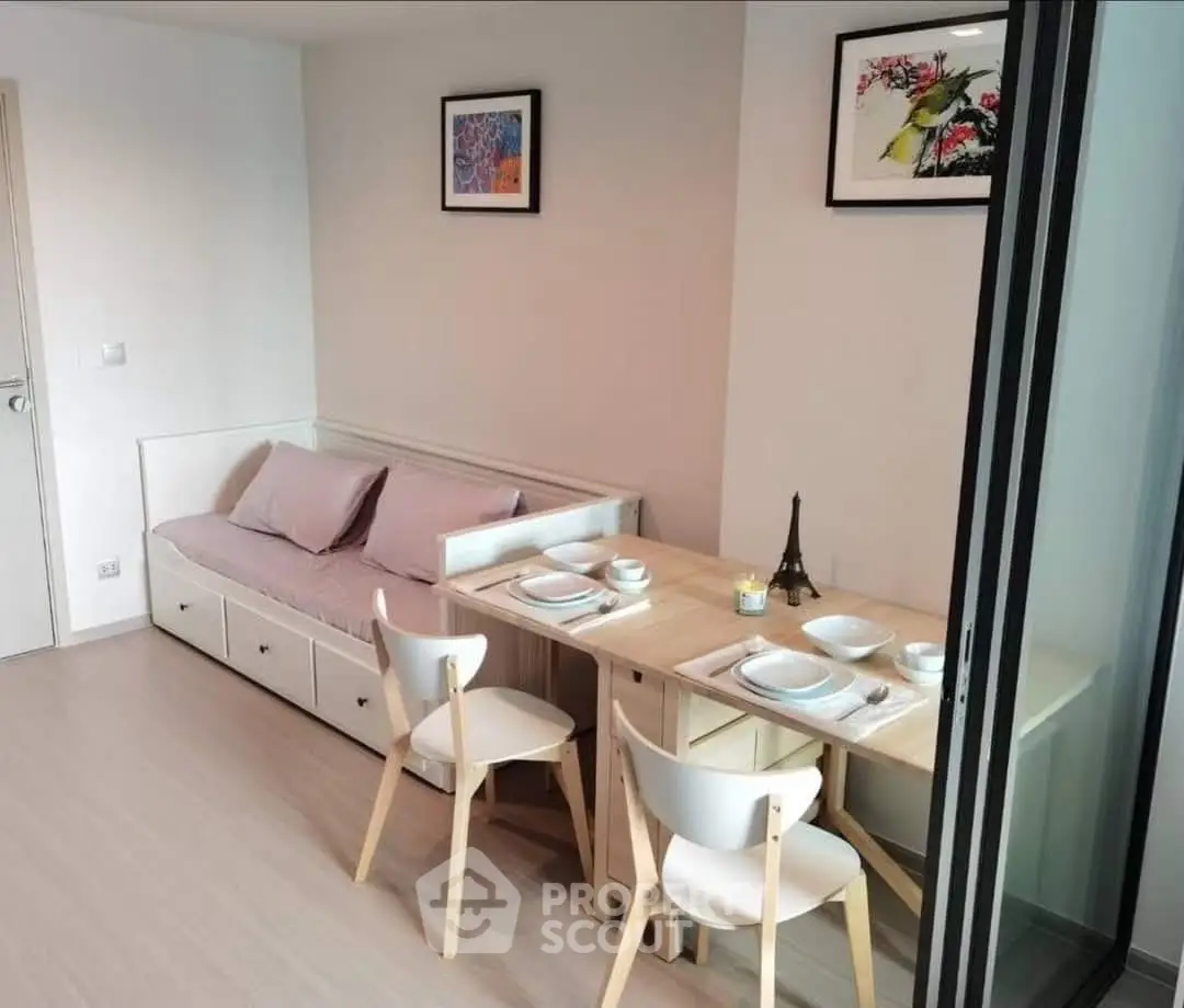 Modern dining area with cozy seating and elegant decor in a stylish apartment.