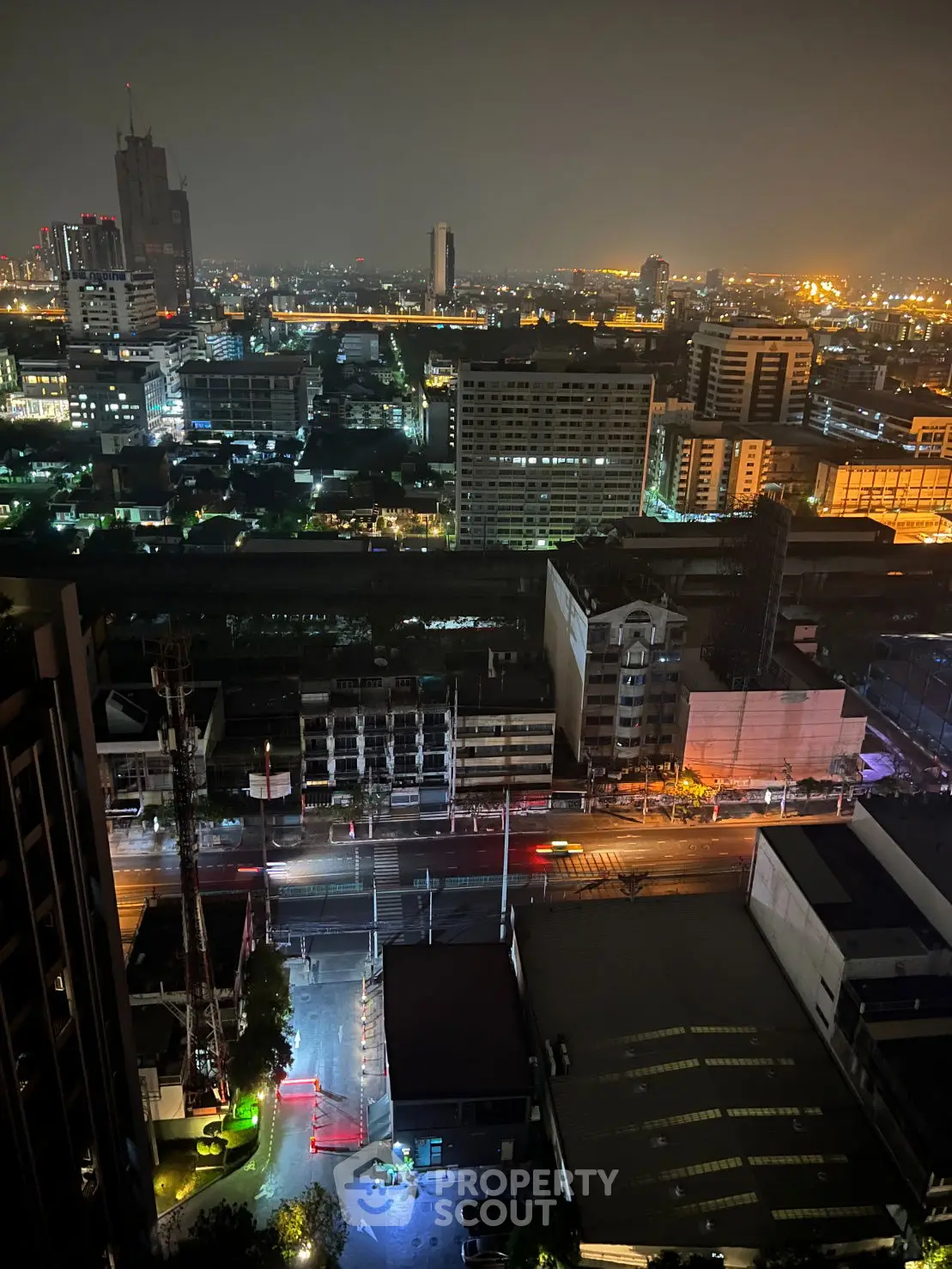 Stunning cityscape night view from high-rise building balcony