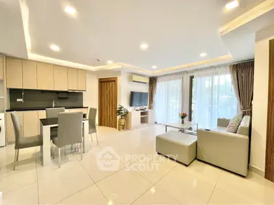 Spacious modern living room with open kitchen and elegant decor