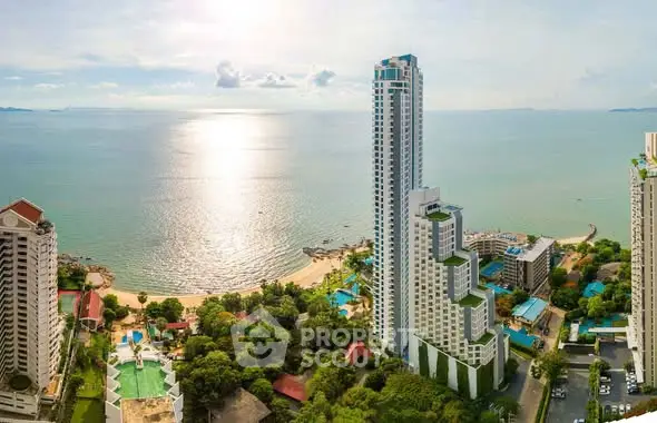 Stunning beachfront high-rise with panoramic ocean views and lush greenery.