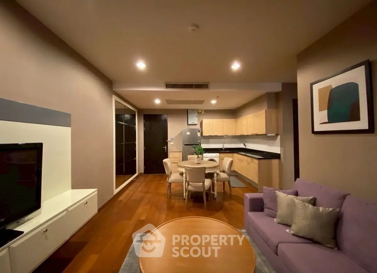 Modern living room with open kitchen and stylish decor