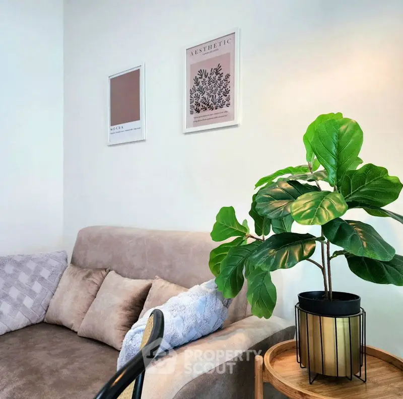 Cozy living room corner with plush sofa and decorative plant