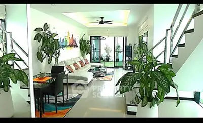 Spacious modern living room with stylish decor and lush indoor plants