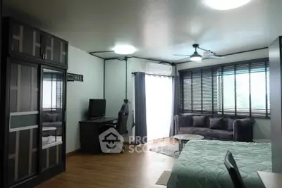 Spacious modern bedroom with large windows and stylish furnishings