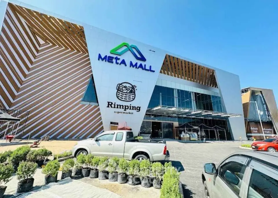 Modern Meta Mall exterior with unique architectural design and ample parking space.