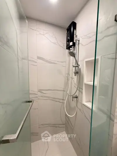 Modern bathroom with sleek shower design and marble tiles