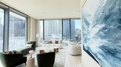 Luxurious modern living room with stunning city view and elegant decor