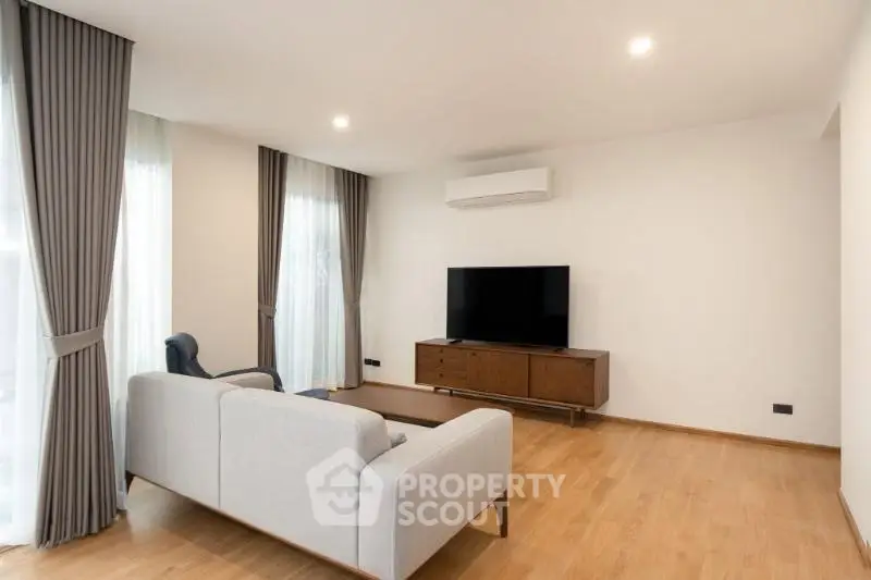 Spacious modern living room with elegant decor and natural light