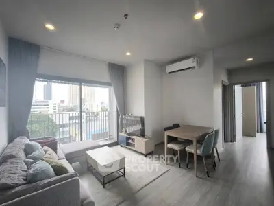 Modern living room with balcony view in urban apartment