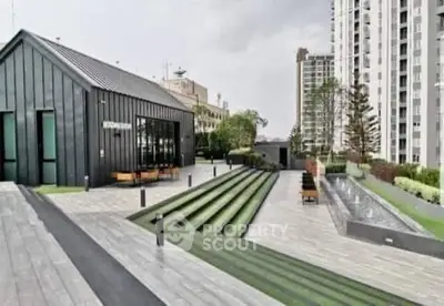 Modern rooftop garden with sleek design and city views, perfect for relaxation and gatherings.