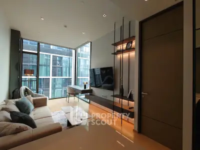 Modern living room with large windows and stylish decor in a high-rise apartment.