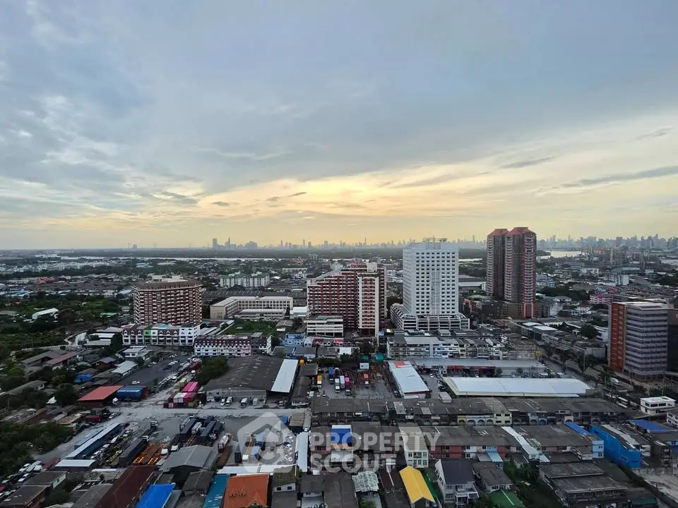 Stunning cityscape view from high-rise building at sunset, showcasing urban skyline and vibrant city life.