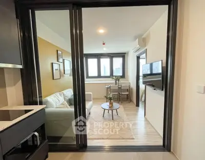 Modern living room with glass sliding doors and cozy decor