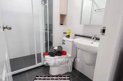 Modern bathroom with sleek design and glass shower enclosure