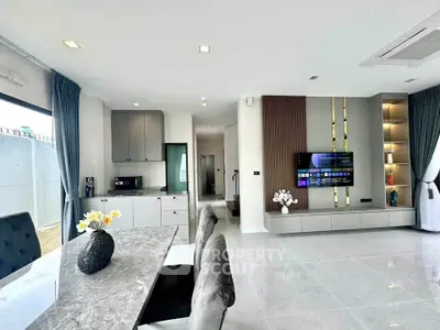 Modern open-plan living room with sleek design and elegant decor