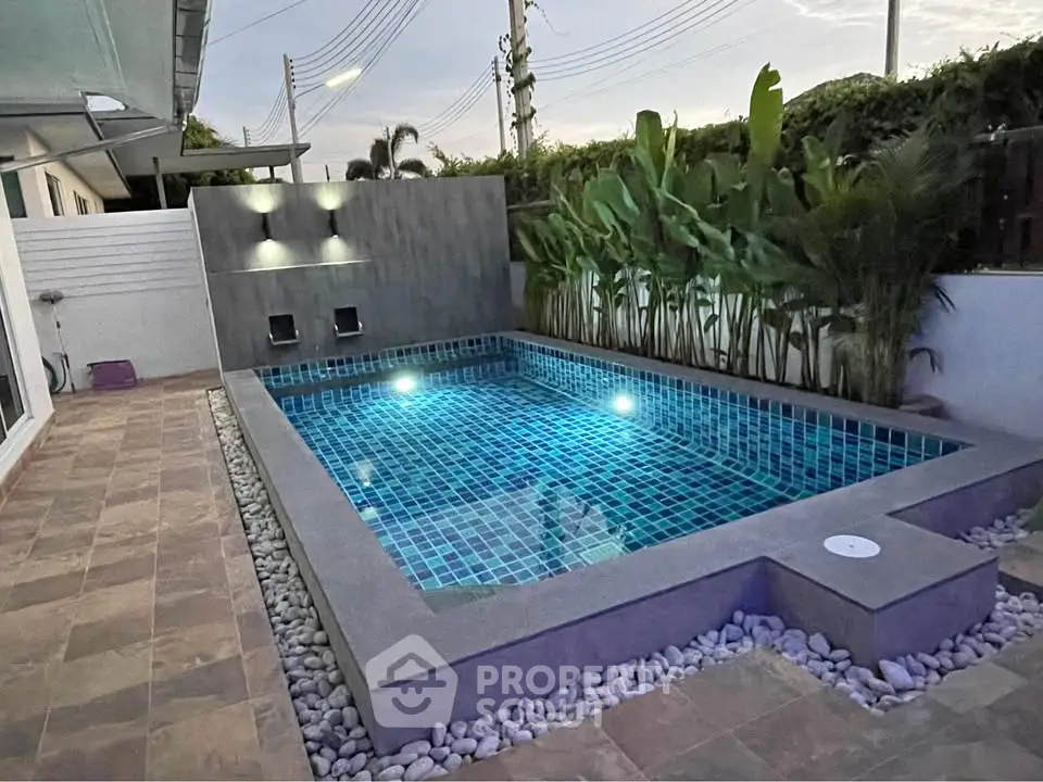 Luxurious private pool with modern design and ambient lighting, perfect for relaxation and entertainment.