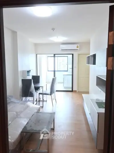 Modern living room with dining area and large window view