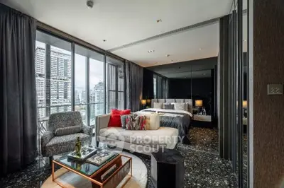 Luxurious modern bedroom with city view and stylish decor in high-rise apartment.