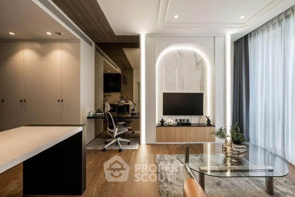 Luxurious modern living room with elegant decor and stylish furniture, featuring a cozy workspace and ambient lighting.