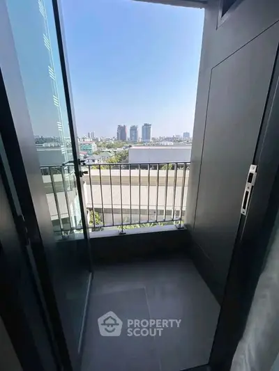 Chic urban balcony with stunning cityscape view, perfect for relaxation and enjoying the skyline.