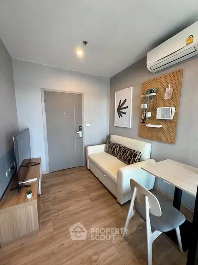 Modern living room with stylish decor and air conditioning in a cozy apartment.
