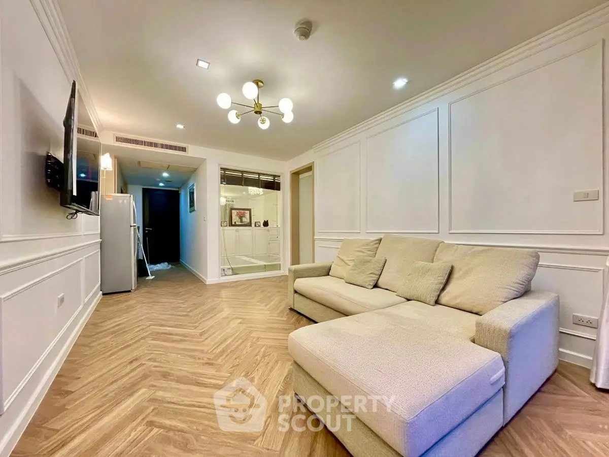 Stylish living room with modern decor and cozy beige sofa in a chic apartment.