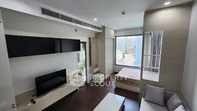 Modern living room with integrated bedroom and city view, featuring sleek furniture and natural light.