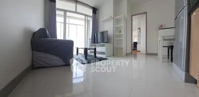Spacious modern living room with sleek tile flooring and natural light